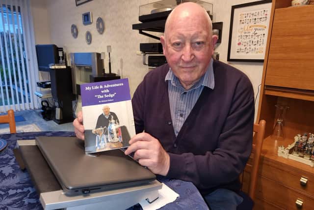 Life-long Liversedge FC fan Michael Holmes, with a copy of his book, ‘My Life and Adventures with The Sedge’