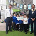 The Mayor of Kirklees, Councillor Masood Ahmed, collecting the cheque.