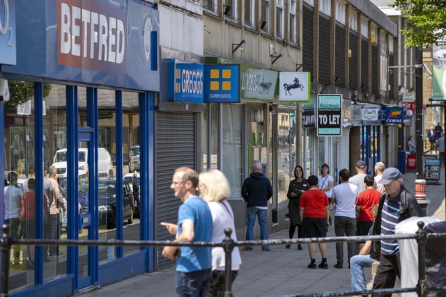 Shoppers in Batley stand outside shops as they reopen for the first time since March 2020. 'Non-essential' shops were permitted to reopen provided they followed Covid-19 secure guidelines set out by the government. Picture: Scott Merrylees