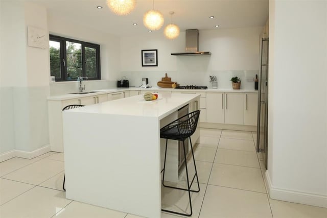 The dining kitchen has contemporary wall and base units, integrated appliances include, dual ovens, 5 ring gas hob with stainless steel extractor fan over, a microwave, a dishwasher and that all essential wine cooler.