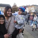 Dewsbury Christmas lights switch-on. Mum Tayyibah Akram with Mohammed Uzair, 11, left, and Mohammed Hunain, two, right.