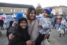 Dewsbury Christmas lights switch-on. Mum Tayyibah Akram with Mohammed Uzair, 11, left, and Mohammed Hunain, two, right.
