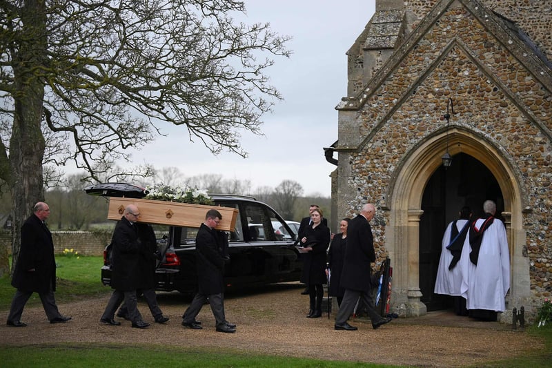 Pallbearers carry the coffin of former Speaker of the House of Commons, Betty Boothroyd, into St George's Church in Thriplow, near Cambridge, for her funeral service