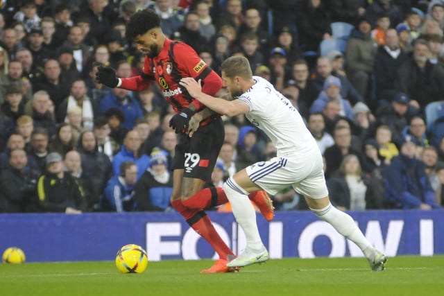 Leeds United skipper Liam Cooper tries to stop Bournemouth's Philip Billing.
