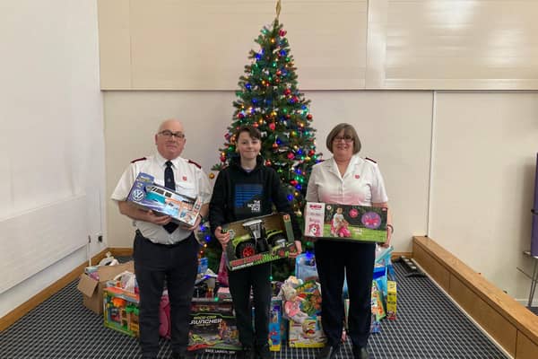 Oscar Sheard pictured with Majors Paul and Carolyn Wilson, of Batley Salvation Army, and his donations for the Christmas Present Appeal