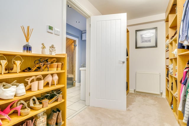 One bedroom has a dressing room and en suite double shower and sauna, and another has fitted wardrobes.