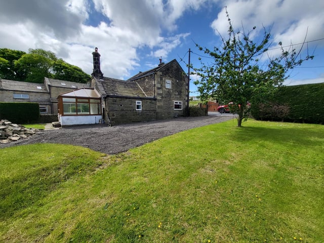 Lawned gardens are to front and rear of the property.