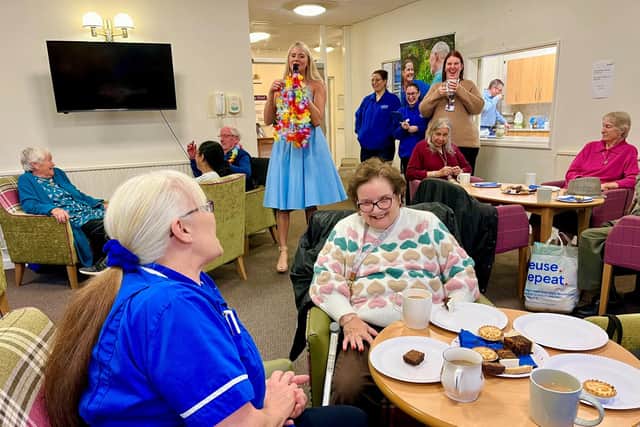 Staff and customers at a recent gathering of the Caremark Coffee Club.
