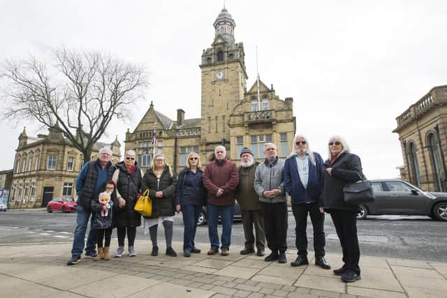 From the left are Alan Gill, Elsie Lee, four, Eileen Gill, Deanna Norman, Kathy Aveyard, Steve Cowan, Jim Saville, Dennis Stanley, Dave Minich and Janice Minich, organisers and supporters of Cleckheaton Folk Festival pictured earlier this year when the 2023 event had to be cancelled. Now they face further disapppointment as doubts are already being cast on whether Cleckheaton Town Hall will be available for next year's festival