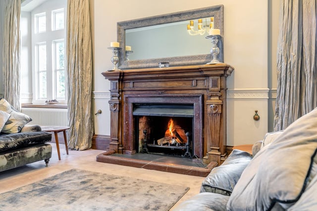 A warming open fire in the lounge, within a stunning oak fireplace with marble inset.