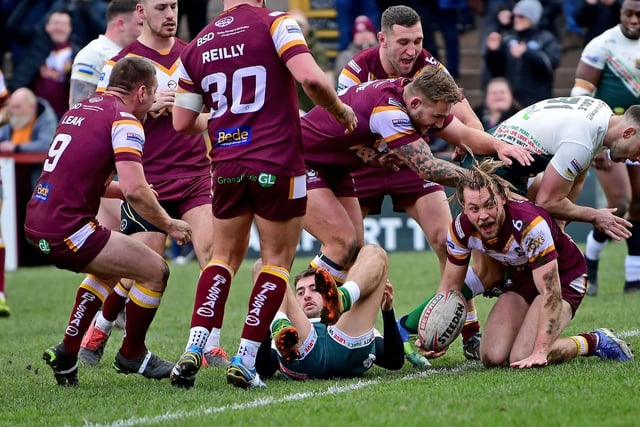 2. Batley celebrate the game's first try thanks to James Meadows crashing over