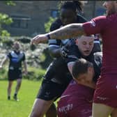 Ryan Crossley in the thick of the action for Dewsbury Moor Maroons against Saddleworth Rangers.