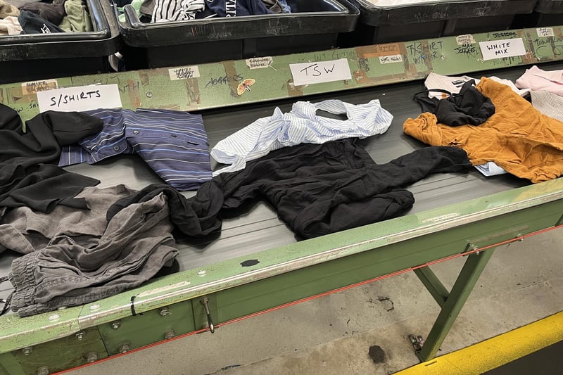 Garments on the conveyor belt at Oxfam's National Sorting Centre.