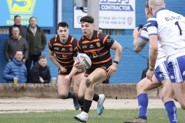 Reiss Butterworth leads the charge of Dewsbury Rams players.