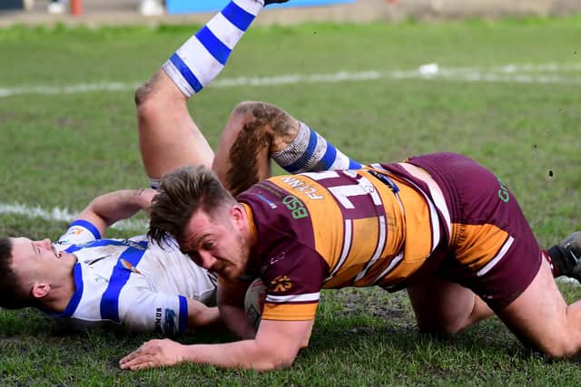 Nyle Flynn goes over for a Batley Bulldogs try last season. Picture: Paul Butterfield