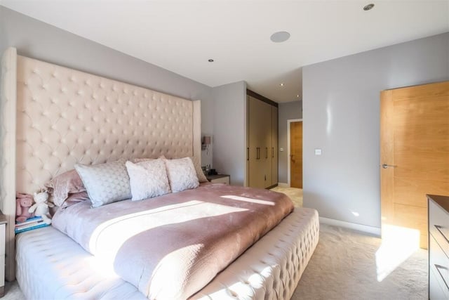 The main bedroom has its own dressing area and en suite facility.