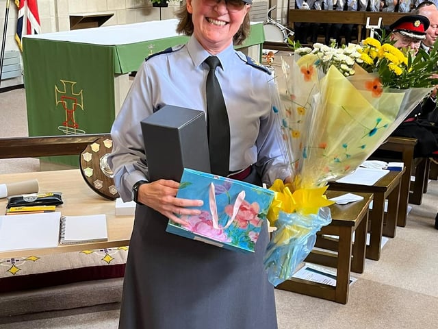 WO Michelle Alford show off the gifts to mark her 40 years with the Air Training Corps.