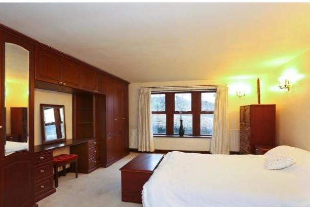 A double bedroom with fitted wardrobes.