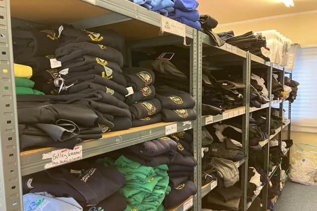 School uniform on the shelves at the Uniform Exchange warehouse