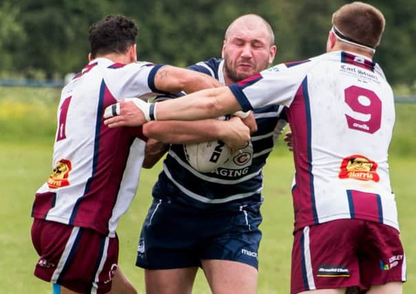 Two Thornhill defenders stop Featherstones Scott Wilson in his tracks during last Saturdays National Conference Division One clash. Picture: Jonathan Buck