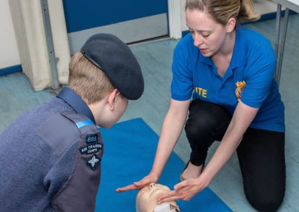 FIRST AID ACTION: A cadet practices CPR at the Air Training Corps exercise.