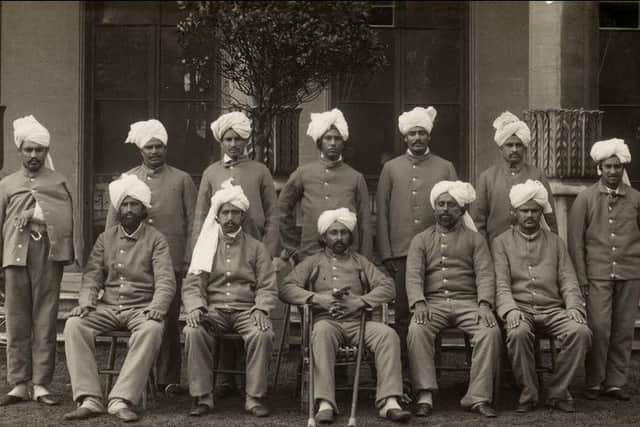 A group photograph of injured Punjabi-Muslim British-Indian Army Soldiers resting at the Brighton Royal Pavilion Hospital.