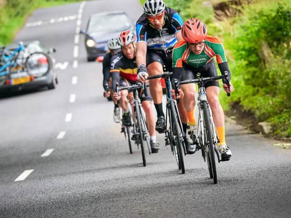 Rules for motorists overtaking cyclists are now under review, with some parts of the UK introducing penalties for those who drive too closely (Photo: Shutterstock)