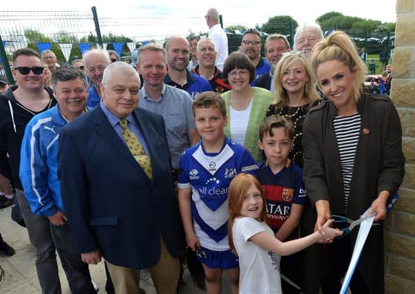 Councillor Andrew Palfreeman, MD of ECO IPS Andrew Walker, Batley and Spen MP Tracy Brabin, leader of Kirklees Council David Shears, Lizzie Jones of the Danny Jones Defibrillator Fund and the trustees of East Bierley Community Sports Association as the club takes control of its facilities.