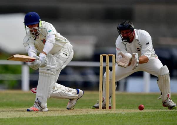 Carlton batsman Dylan Kotzeclips the ball away under the watchful eye of Liversedge wicketkeeper Matt Butler.