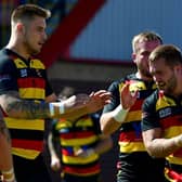 Robbie Ward is congratulated by Dewsbury Rams teammates after scoring one of his two tries in last Sundays Championship defeat to high flying Leigh Centurions. Picture: Paul Butterfield.