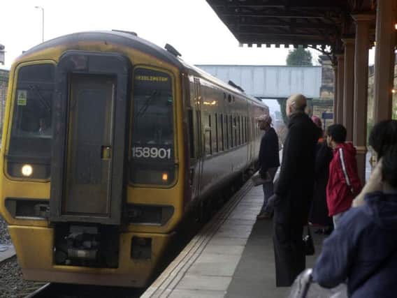 Passengers boarding a train at Batley Train Station.