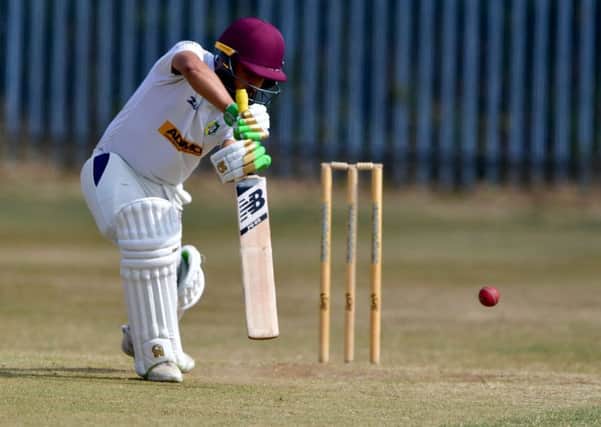 Scholes batsman Kasir Maroof drives the ball during his sides Premier Division game at Townville last Saturday.