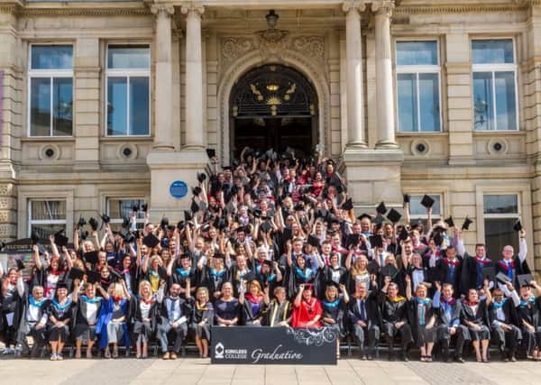 High achievers: Kirklees College students pose for a photograph outside Dewsbury Town Hall.