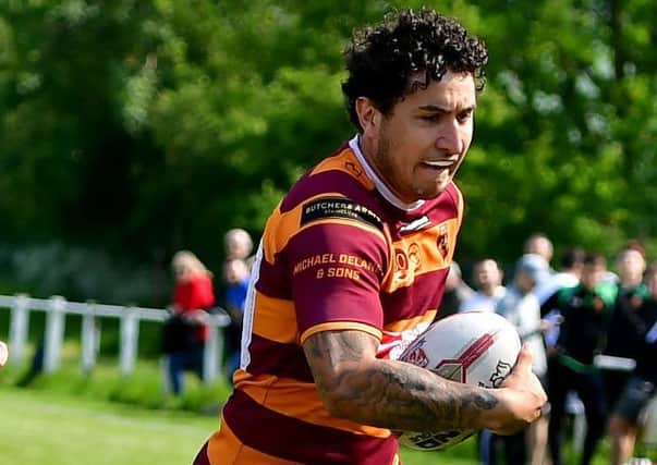 Second-placed Moor were pushed hard by relegation strugglers Hunslet Warriors in Division Two.