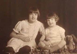 Early years: Dorothy as a child, pictured with her elder sister Elma.