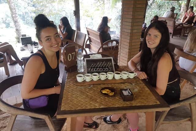 Eva Hague, 22, and Megan Bradbury, 18, enjoy dinner in Bali four days before the attack.