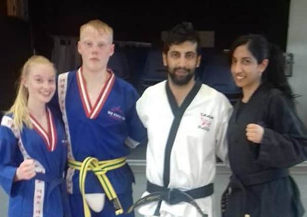 World Champion Zeeshan Zafar with students Daniel Foster, Natasha Zafar and Ebony Dyson.