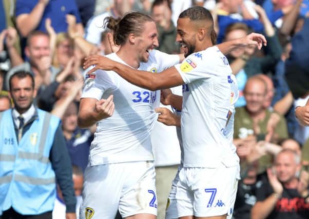 Luke Ayling celebrates his goal with fellow goal scorer Kemar Roofe. Picture: Bruce Rollinson
