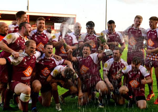 Thornhill A celebrate their victory over Dewsbury Moor Maroons as they retained the Heavy Woollen John Kane Cup.