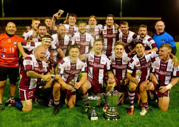 Thornhill Trojans celebrate winning the Heavy Woollen Jim Brown Cup for a fourth successive year