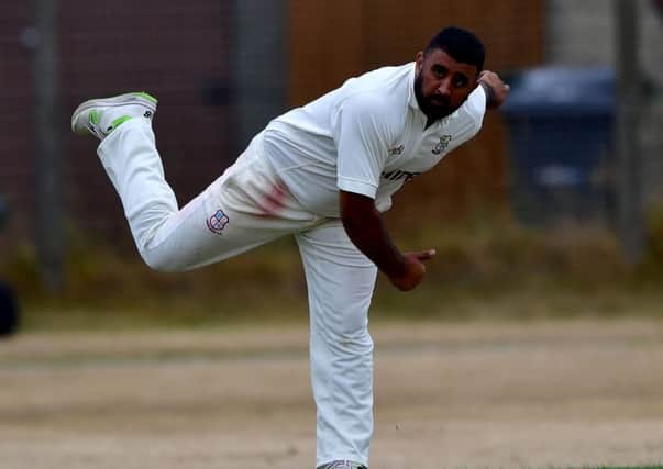 spin bowler Kez Ahmed picked up 5-21 to help Woodlands dismiss Scholes for 115 on their way to a nine wicket win.