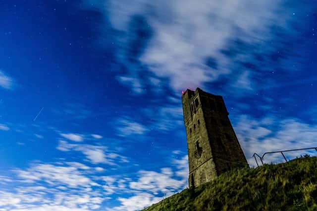 Date: 8th October 2017.
Picture James Hardisty.
Possible Picture Post.....A Draconid meteors pasing over head in night's sky at Castle Hill, Huddersfield, West Yorkshire, just visible through the cloud base last night (Sunday).