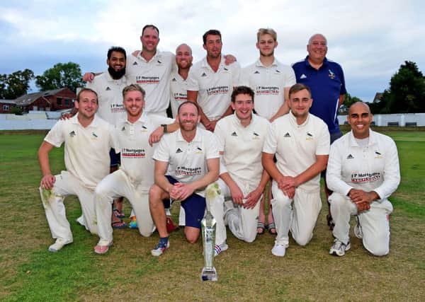 Hanging Heaton celebrate winning the Solly Sports Heavy Woollen Cup with victory over New Farnley last Sunday.  Pictures: Paul Butterfield