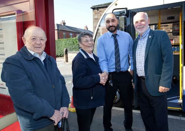 CELEBRATION: Cllr Eric Firth is pictured with long-time bus service users Mr and Mrs Smith and regular bus driver Paramjit.