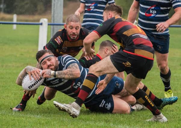 The Shaw Cross defence are unable to prevent Dean Gamble crashing over for a try.