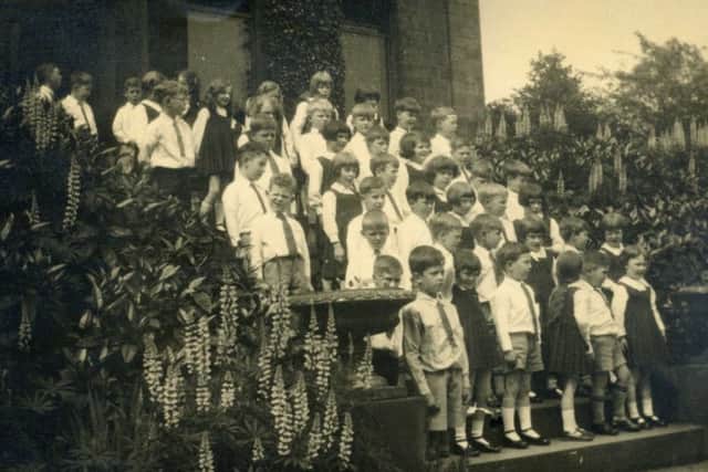 Trust project: Pictured are pupils of the former Marlborough School in Halifax Road, the first building to be bought from proceeds of charity trusts set up to administer the wills of John Wheelwright and Matthew Hinchcliffe.