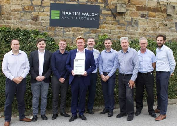 COMMITMENT TO EXCELLENCE: Matt Robinson, pictured centre, said the RIBA status placed the company on the highest pedestal.