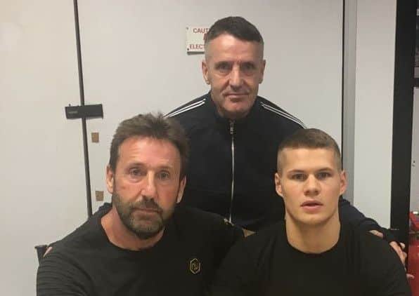 Heckmondwike boxer Cory O'Regan with Mark and Martin Bateson.