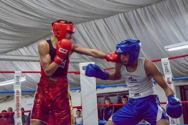KBWs Mohamed Subhaan lands a blow against Ibrahim Suleiman.