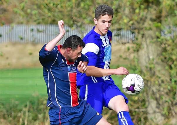 Overthorpes Jake Harrison attempts to challenge Crofton Sports attacker Josh Buxtan during last Saturdays Wakefield League Premier Division clash